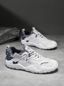 男士休闲时尚运动鞋，鞋跟印花，鞋面编织交叉绑带设计，呈现清新层次感十足的都市运动休闲风格。 - 灰色 - 查看 6