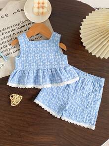 Bộ đồ thường ngày dễ thương cho bé gái, áo không tay vải jacquard màu xanh dương có họa tiết phối cùng quần short màu xanh navy viền ren trắng, bộ 2 món. - Màu xanh lam - Xem 2
