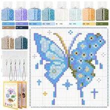 10瓶2.6毫米熔珠套装，蓝色蝴蝶图案，可用于制作风铃、冰箱贴，包含各种颜色的挂绳和透明洞洞板，附带说明书。 - 2.6mm拼豆豆 - 查看 1