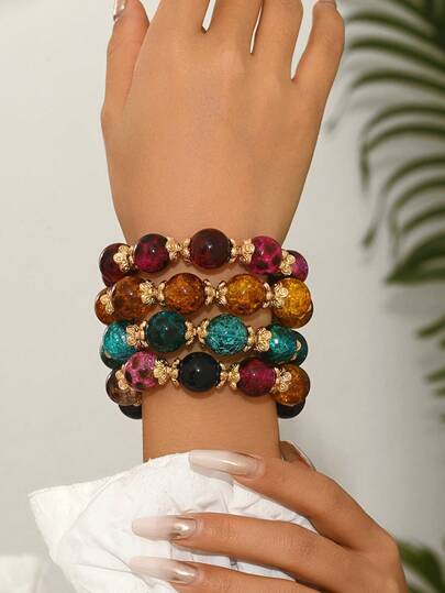 这款时尚优雅的波西米亚风多巴胺豹纹串珠手链套装，采用CCB花朵底座和弹力绳，适合派对、晚宴、海滩、度假等场合，可叠戴或单独佩戴，展现女性独特魅力。树脂花朵图案颜色随机变化，模具痕迹属正常现象。