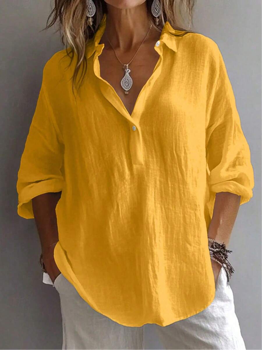 Áo sơ mi nữ tay dài màu trơn, kiểu tay cánh hoa, cổ bẻ, dáng suông, cài nút, thích hợp mặc hàng ngày.