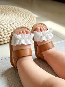 Dép xăng đan đế mềm mùa hè cho bé gái, kiểu dáng dễ thương với bèo nhún, có thể điều chỉnh độ dài, chống trơn trượt. Giày tập đi cho bé sơ sinh. - màu nâu - Xem 12