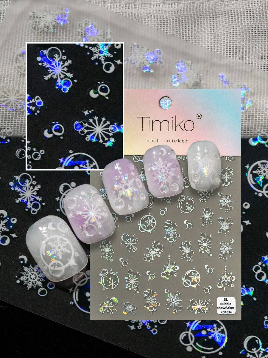一张梦幻冬日美甲贴纸，饰有雪花和透明气泡，采用全息虹彩效果，折射出迷人的彩虹色调，搭配精致的透明气泡和圣诞装饰，整体设计散发出梦幻般的冬日气息和节日氛围。梦幻浪漫的风格，璀璨夺目，是喜爱冬日美学、圣诞节庆典和奇幻之美人士的理想之选。 - 彩色 - 查看 1