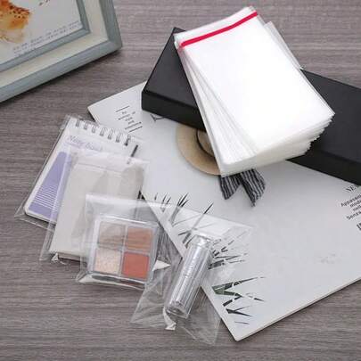 100 حزمة من أكياس السيلوفان C6 بمقاس 4.5 * 6.5 بوصة، أكياس شفافة لاصقة ذاتية، أكياس عرض سيلوفان/أكياس قابلة للإغلاق، للأطعمة والبسكويت والبطاقات والمظاريف والصور (11.5 * 16.5 سم)