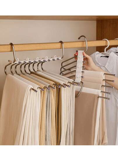 1 Giá phơi quần áo nhiều tầng có thể gập lại, kiểu dáng tối giản hiện đại, làm bằng thép không gỉ màu đen, có chân đế chống trượt và lỗ móc treo, thích hợp để đựng quần, cà vạt, áo ngực, khăn tắm, tiết kiệm không gian và tiện dụng.