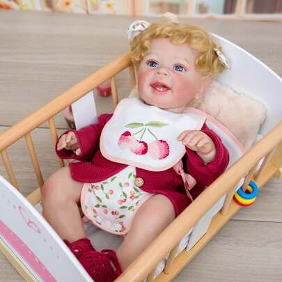 Cloveray Handcrafted Gold-Stamped Curly Hair, Cherry Bib Design, Movable Joints, Realistic Skin Texture, Children's Companion Doll, Collectible Doll. Soft Rubber Material Creates A Realistic Baby Form, With Handcrafted Gold-Stamped Curly And Fluffy Hair, Paired With A Festive Bib With Cherry Pattern. The Joints Are Flexible For Posing, And The Skin Texture Is Delicate And Lifelike. Adorably Cute In Expression, It Serves As Both A Children's Comfort Doll And An Adult's Decorative Piece, Exuding A Festive Atmosphere.