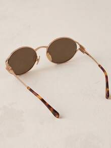 Miu Miu 黑色椭圆形镜框金色Logo防紫外线时尚女士太阳镜，夏季海滩风 - 黑色 - 查看 4