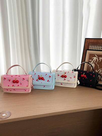 这款时尚甜美的樱桃图案PU方形手提包，配有可调节肩带，可斜挎背戴。适合各种场合和用途，是户外活动、玩耍、通勤等的理想之选，也是送给青少年的完美礼物。