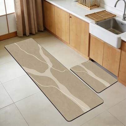 1 tấm thảm bếp bằng gel silica, nền màu kaki nhạt với kết cấu mịn như đá, kết hợp với hai đường lượn sóng màu trắng sữa mượt mà, tạo nên họa tiết Wabi-Sabi đơn giản, nhẹ nhàng và tự nhiên. Thảm bếp cao cấp thời trang, êm ái và chống mỏi, chất liệu vải bề mặt, lớp xốp thấm hút ở giữa.