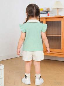 Baby Girl Summer Knit Set: Mint Green Ribbed Polo Shirt (Contrast Collar + Strawberry Decor + Ruffle Sleeves) & White Apricot Ruffle Hem Shorts 2Pcs, Soft Knit Fabric, Breathable & Skin-Friendly, Delicate Decor, Light Color Suitable For Summer Daily/Light Social Occasions, Comfortable & Easy To Wear & Care, Creating A Cute Outfit - Mint Green - View 2