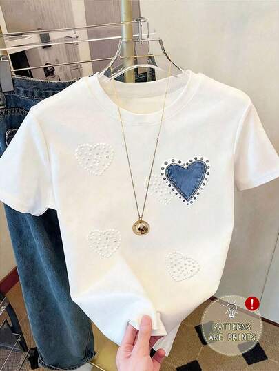 Camiseta de manga corta con cuello redondo y talla grande para mujer, diseño con estampado de corazón, longitud regular, tela con alto nivel de elasticidad