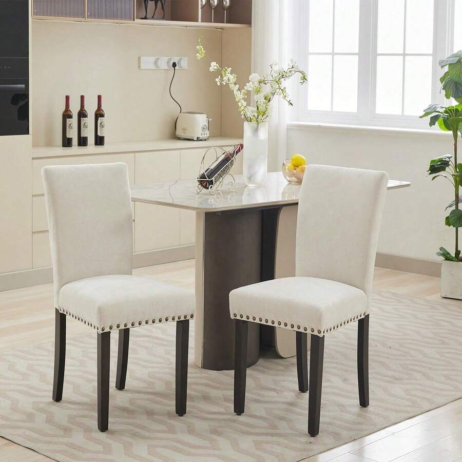 Sillas de comedor Set de 2 Unidades, silla de comedor de tela de lino Parsons con adorno de cabeza de uñas y piernas de madera resistentes, para espacio pequeño - Beis - Ver 1