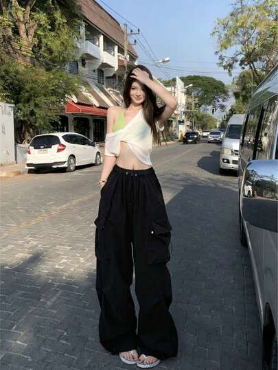 Quần cargo phong cách hippie thường ngày, thoải mái, thoáng khí, thiết kế cao cấp với túi lớn và dây rút ở eo, phù hợp cho mùa xuân, hè và thu. Màu đen.