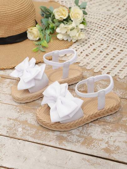 1 đôi dép xăng đan đế bằng màu trắng cỡ lớn cho bé gái, quai vải trơn có nơ trang trí, hở mũi, thoải mái, kiểu La Mã dễ thương, phù hợp cho bé gái từ 3-15 tuổi, dùng hàng ngày, đi du lịch, nghỉ mát, mùa hè. Hàng mới về.