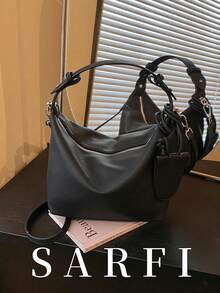 This Simple Crescent-Shaped Women's Handbag Comes With A Matching Small Charm. It Features An Adjustable Shoulder Strap And Is A Modern, Elegant, And Commuter Bag. Made Of High-Quality, Wear-Resistant, Waterproof, And Scratch-Resistant PU Material, It Boasts A Premium Hardware Zipper Closure For Easy Access. It Is Suitable As A Gift For Friends, For Shopping, Dates, Commuting To Work, Taking Photos, Business Trips, And Travel. - Black - View 1
