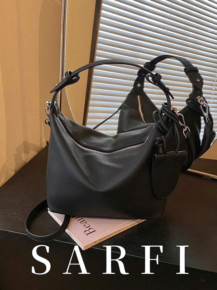 This Simple Crescent-Shaped Women's Handbag Comes With A Matching Small Charm. It Features An Adjustable Shoulder Strap And Is A Modern, Elegant, And Commuter Bag. Made Of High-Quality, Wear-Resistant, Waterproof, And Scratch-Resistant PU Material, It Boasts A Premium Hardware Zipper Closure For Easy Access. It Is Suitable As A Gift For Friends, For Shopping, Dates, Commuting To Work, Taking Photos, Business Trips, And Travel. - Black - View 1