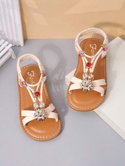 1 Pair Girls' Beige Flat Sandals, Solid Soft PU Criss-Cross Strap + Shiny Crystal & Red Agate Decor, Round Toe Soft Non-Slip Slip-On Design, Fashionable Cute Bohemian Beach Sandals, Suitable For Casual, Beach, School, Dance, Spring/Summer