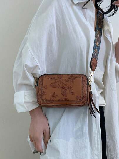 1个波西米亚风纯色压纹简约时尚斜挎包，PU皮革材质，多个拉链口袋，带相机袋，花卉图案，便携，适合户外、购物、度假、通勤等场合，手提包