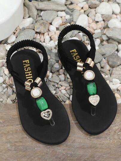 1 đôi dép xỏ ngón đế bằng màu đen cho bé gái, chất liệu vải dệt mềm mại, quai chéo màu trơn kết hợp với đá mã não xanh lấp lánh, mũi tròn, thiết kế mềm mại chống trơn trượt, dép đi biển phong cách bohemian dễ thương, phù hợp cho sinh hoạt hàng ngày, đi biển, đi học, khiêu vũ, mùa xuân/hè.