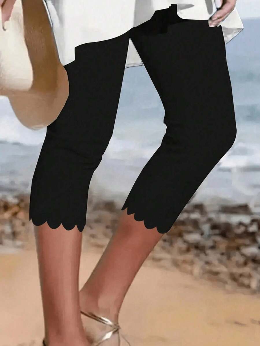 Quần legging lửng nữ màu đen co giãn cao, có viền bèo nhún, thoải mái và thời trang. - màu đen - Xem 1