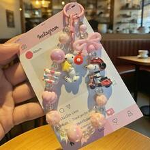 SNOOPY 这款超萌的史努比串珠手机挂件来啦！色彩缤纷的串珠搭配可爱的史努比吊坠，配色温柔甜美，挂在手机、包包、耳机盒上都非常吸睛。手工串珠结实耐用，不易松动，兼具美观与百搭性。无论是日常出行还是日常佩戴，都能营造完美氛围，是年轻女孩的必备单品！（随机款式） - 彩色 - 查看 8