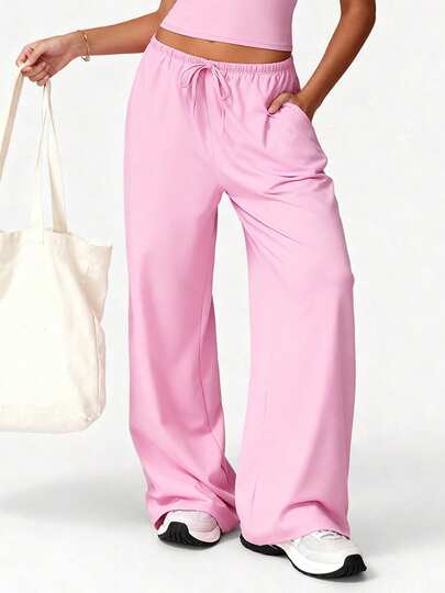  Quần thể thao nữ TCVC Xuân/Hè mới về, chất liệu cao cấp, bề mặt mờ, co giãn tốt, dáng rộng thoải mái, nhẹ, mềm mại, thoáng khí, ống rộng có dây rút, có túi đựng điện thoại, kiểu ống rộng tôn dáng, phù hợp cho khởi động ở phòng tập, mặc nhà, phong cách đường phố ở sân bay và hoạt động thể thao hàng ngày trong thành phố.