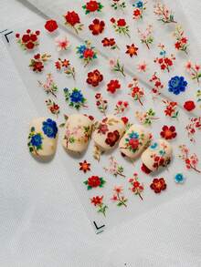 1张中国风花卉美甲贴纸，以经典中国花卉——红玫瑰、梅花、樱花、蓝菊为特色，融合了新式中国风、民族风和复古宫廷美学，优雅奢华。适用于新娘美甲、新年美甲及其他庆祝场合，为指尖增添东方韵味和节日气氛。 - 彩色 - 查看 5