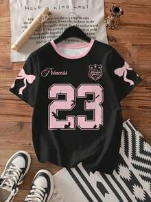 Una camiseta holgada de manga corta y cuello redondo en negro y rosa claro, con un sencillo diseño del número 23, adecuada para el verano y diseñada específicamente para mujeres. - Colores mixtos - Ver 8