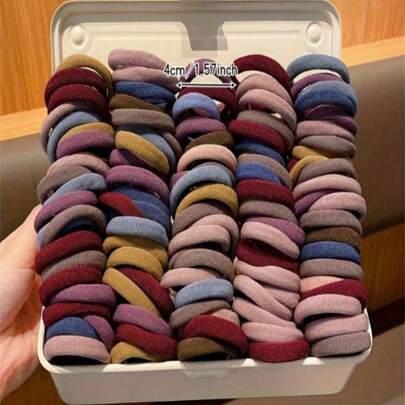 100个/包，女士基础款发圈，简约无缝弹力带，适合女性佩戴。时尚简约，舒适透气，高弹力，高强度橡胶圈，可重复使用，可用于扎马尾辫。这款高弹力发圈对头发非常温和，不会损伤发质。是日常使用的理想之选。