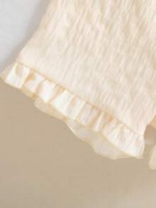 Bộ đồ 2 mảnh dễ thương cho bé gái, gồm áo không tay cổ tròn màu trơn phối bèo nhún và quần short phối bèo nhún, thích hợp cho các hoạt động hàng ngày vào mùa xuân/hè. - Màu be - Xem 7