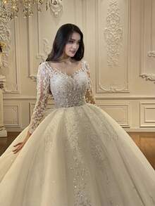 Luxury Long Sleeve V-Neck Ball Gown Wedding Dress With Crystal Beading, Tulle Skirt, And Cathedral Train – Premium Lace And Tulle With Hand-Applied Crystal Embellishments, Fitted Bodice With Boning, V-Neckline With Illusion Lace, Cathedral Train With Lace Edging, Available In Ivory – Perfect For Fall/Winter Indoor Weddings, Palace Ceremonies, And Destination Weddings, Warm And Elegant Design, Ideal For Cooler Weather, International Export Quality, Suitable For Global Bridal Market - trắng - Xem 3