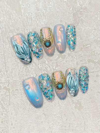Fingertip Fantasy Ocean 10片装手工中号椭圆形手绘蓝色美人鱼尾巴，饰有3D凝胶气泡和蓝色闪粉，尽显奢华质感。完美搭配度假风和海边装扮。高端外观，非常上镜，与泳装相得益彰。可重复使用的手工按压式美甲套装，包含一张果冻凝胶片和一个迷你指甲锉。