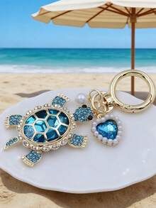 Móc khóa hình rùa bằng hợp kim kẽm với ngọc trai và thiết kế hình trái tim, lấy cảm hứng từ đại dương, thích hợp làm quà tặng Ngày Valentine, Ngày của Mẹ, Ngày của Cha, Ngày Quốc khánh, cho những người yêu thích biển. Móc khóa dễ thương và bền chắc cho túi xách, phụ kiện xe hơi, quà tặng cho bạn bè và gia đình. Mặt dây chuyền hình động vật biển đính đá. - Nhiều màu - Xem 7