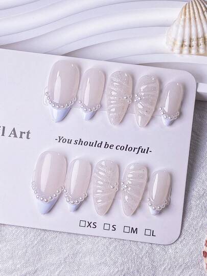 10 Pieces Of Handmade Almond-Shaped Nails With White French-Style Edges, Adorned With Pearl Chains, Silver Glitter Water Ripple Patterns, And Pearl Decorations. White Nails, Simple And Versatile Design, Stylish And Sophisticated Feel. Suitable For Any Occasion And Can Be Easily Worn Or Removed With A Push-Button Nail Art System.