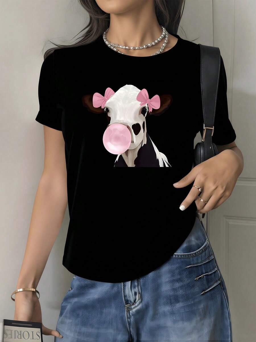 Vaca con lazo rosa y chicle que transmite diversión y ternura reflejando una actitud alegre y creativa perfecta para un look relajado camiseta de mujer casual 220g - Negro - Ver 1