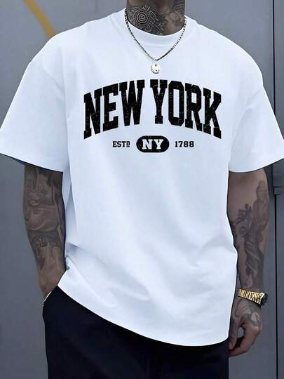 El gráfico muestra las letras NEW YORK que simbolizan el espíritu urbano la libertad y la energía de la gran ciudad inspirando confianza y determinación en quien la lleva camiseta de hombre talla grande 100% algodón de alta calidad cómoda y moderna para uso diario