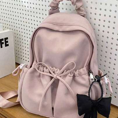大容量轻便背包，蝴蝶结装饰功能性背包，多功能学生背包，带蝴蝶结吊坠的休闲旅行背包，耐用背包，大容量，可调节肩带，适合毕业生、青少年女孩、大学新生、大二学生、大三学生、大四学生、高中生，非常适合户外活动、返校旅行和上学使用。