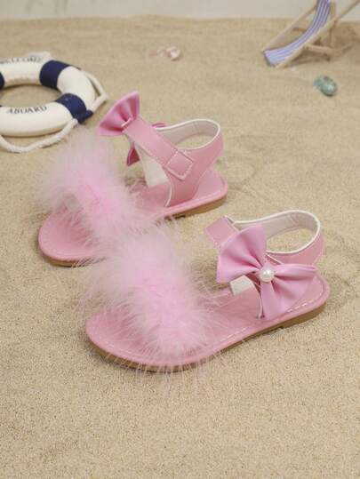 1双夏季粉色毛绒蝴蝶结女童凉鞋，软底防滑魔术贴透气沙滩鞋