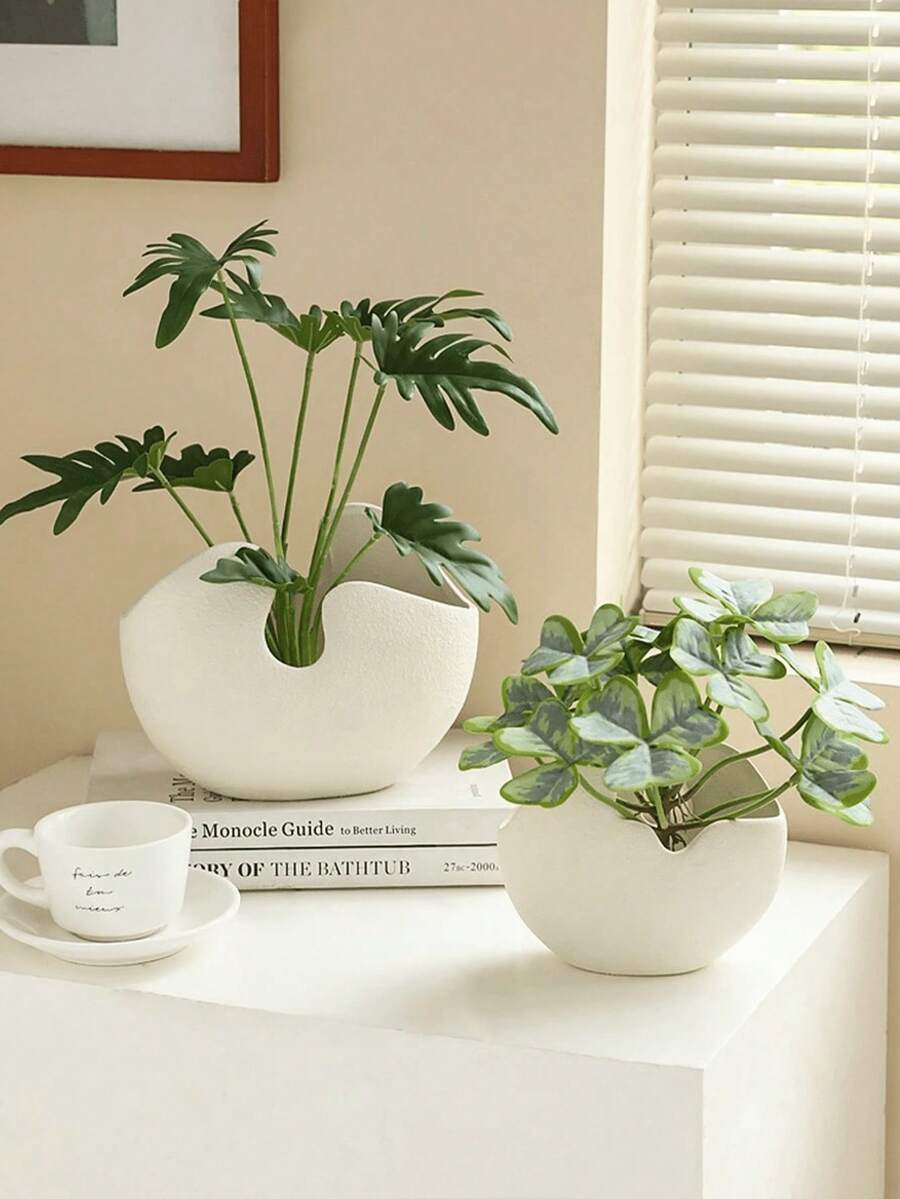 Bình và chậu cây bằng nhựa có vân, được thiết kế nghệ thuật với hình dạng bất thường, rất thích hợp để trưng bày các loại cây nhỏ hoặc cây lá trên bàn cà phê, bàn làm việc hoặc bệ cửa sổ. Nó mang đến nét tối giản và tự nhiên cho không gian sống và văn phòng hiện đại. - Phiên bản vỏ trứng - Xem 1