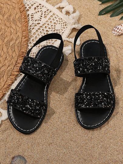 1 Đôi dép xăng đan đen lấp lấp lánh cho bé gái, màu trơn thời trang, đế cao su mềm chống trượt, thiết kế một chạm, mũi tròn, chất liệu PU mềm mại, dép hở mũi cho trẻ em, phù hợp cho bé gái từ 3-15 tuổi, thích hợp mang hàng ngày, đi du lịch, nghỉ lễ, ở nhà, dự tiệc, ngoài trời, mẫu giày mới xuân hè 2026 cho bé gái.
