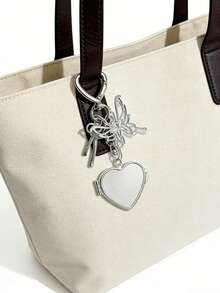 金属心形和星形装饰钥匙扣，银色镂空蝴蝶吊坠，内置迷你镜子，包包装饰钥匙扣，生日、情人节、母亲节送给女性的小礼物，情侣包包配饰，时尚挂饰，手提包和钱包的时尚吊坠，便携式化妆配件，适合女性、女孩、爱美人士和送礼者。 - 彩色 - 查看 3