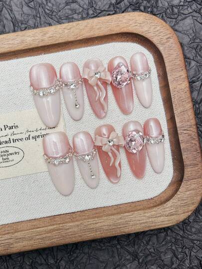 10片手工椭圆形亚克力按压式美甲，长款柔粉色美甲，闪亮猫眼美甲，粉色法式美甲，镶嵌大颗水钻和3D蝴蝶结，时尚优雅简约的春季假指甲，夏季美甲，适合派对、日常佩戴、约会、海滩度假等场合，DIY美甲，适合女性和女孩作为礼物，美甲用品。