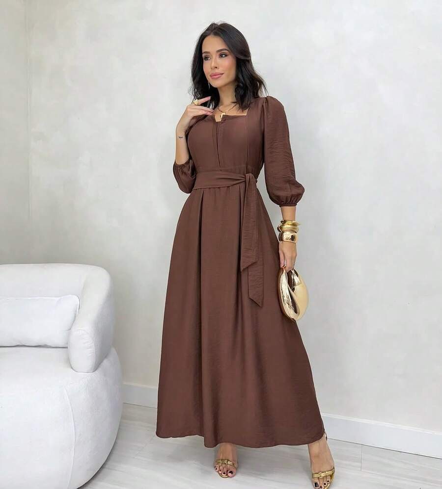 Mirella Long Dress • Winter Style • Square Neckline With Unique Front Opening And Buttons • 3/4 Puff Sleeves With Elastic • Adjustable Belt • Defined Waist • Flowing A-Line Silhouette - Rỉ Nâu - Xem 1