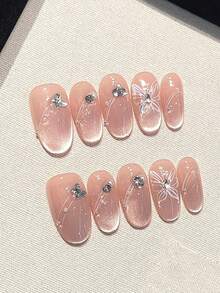 10片高品质手工按压式粉色猫眼美甲贴，手绘可爱蝴蝶闪亮钻石白珍珠图案，适合气质温柔的女士和女孩在日常舞会等场合佩戴。附赠可拆卸美甲贴、果冻胶和摩擦条。 - 彩色 - 查看 4