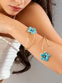 Một chiếc nhẫn hình hoa hai đầu bằng men mài bóng, kiểu dáng hở ngón tay, mang vẻ thanh lịch cổ điển, thích hợp cho những kỳ nghỉ ở bãi biển. - Nhiều màu - Xem 12