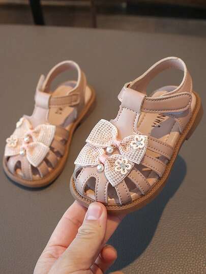 1 Đôi dép xăng đan thời trang dễ thương cho bé gái, dép xăng đan mùa hè mới, kiểu dáng tối giản, thoải mái, có nơ trang trí, thích hợp đi học ngoài trời.