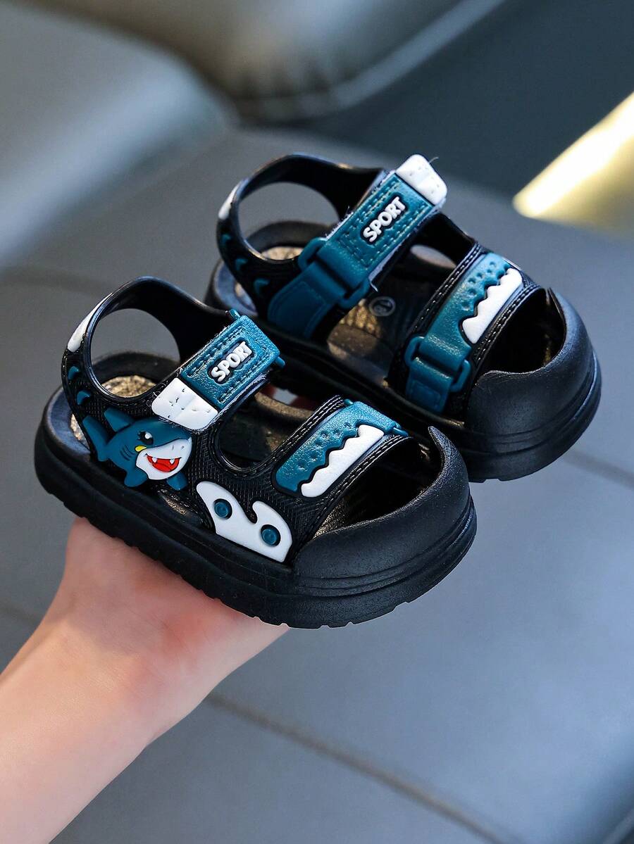 Dép xăng đan trẻ em hình cá mập hoạt hình dễ thương, đế mềm, thoải mái, có khóa dán, đa năng, thích hợp cho mùa hè.