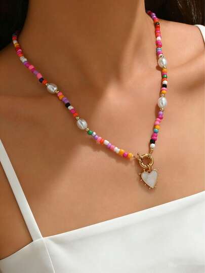 1 chiếc vòng cổ kiểu Bohemian đính hạt giả ngọc trai nhiều màu sắc với mặt dây chuyền hình trái tim, tối giản và ngọt ngào dành cho bé gái.