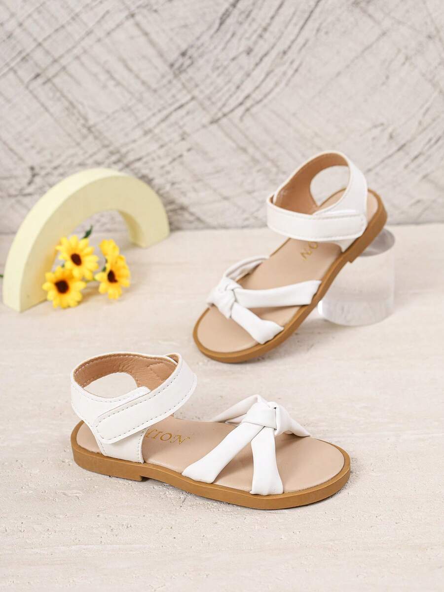 1 đôi dép xăng đan mùa hè kiểu Âu và Mỹ mới cho bé gái, giày bé gái, giày trẻ em, dép xăng đan trẻ em, dép xăng đan mùa hè thắt nơ cho bé gái, giày đế mềm màu trắng có khóa dán cho trẻ em, giày thể thao hở mũi thoáng khí chống trượt cho bé tập đi, dép xăng đan đế bằng. - trắng - Xem 1