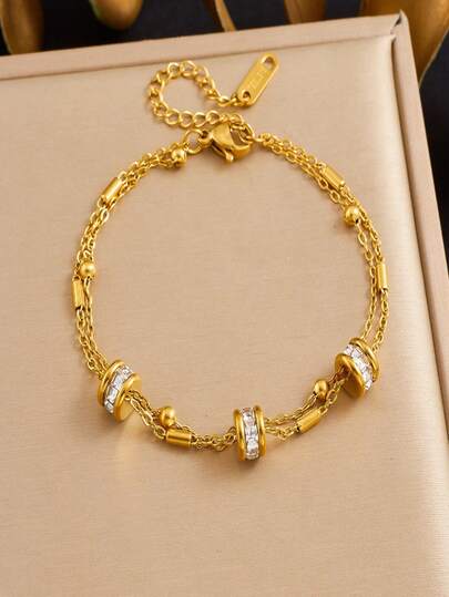 1 chiếc vòng tay charm tròn bằng thép không gỉ mạ vàng sang trọng, hai lớp, có thể xếp chồng lên nhau.
